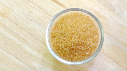 brown sugar in bowl on wooden background