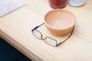Glasses and a clay bowl