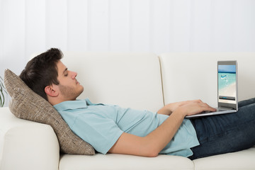 Man Watching Video On Laptop