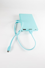 Portable power bank for charging mobile devices on the white bac
