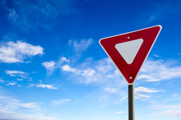 Traffic Yield Sign With Blue Sky Background