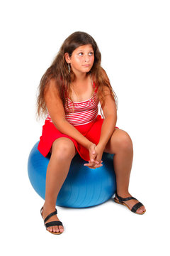 Girl Sits On Blue Ball