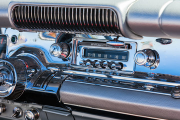 Car radio into the dashboard which is chromed