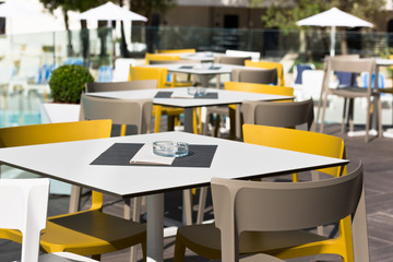Summer cafe with plastic furniture