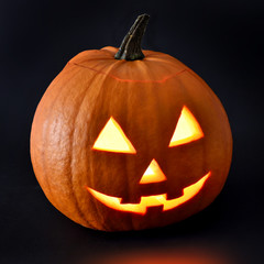 Halloween pumpkin with scary face and black background. Pumpkin, isolated on black background.