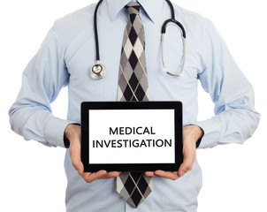 Doctor holding tablet - Medical investigation