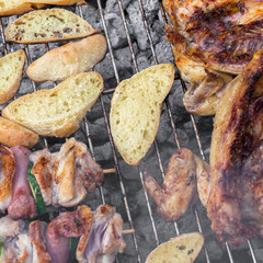 Chicken and bread on grill