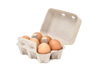 Abwaschbare Fototapete egg in packaging paper mould box isolated on white background © F16-ISO100