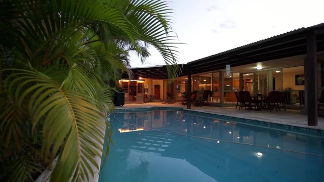 Swimming pool at dusk in stylish home