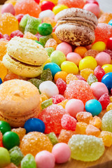 Fototapeta na wymiar Colorful candies and macaroons