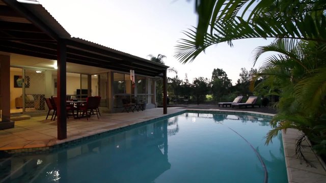 Swimming pool at dusk in stylish home