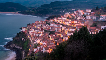 Obraz premium View of the city of Lastres at sunset, Asturias.Spain