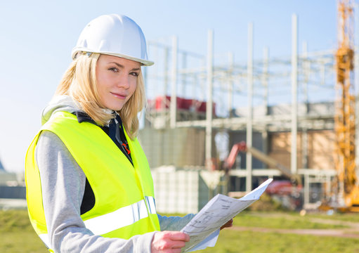 Portrait of an attractive woman worker on a construction site