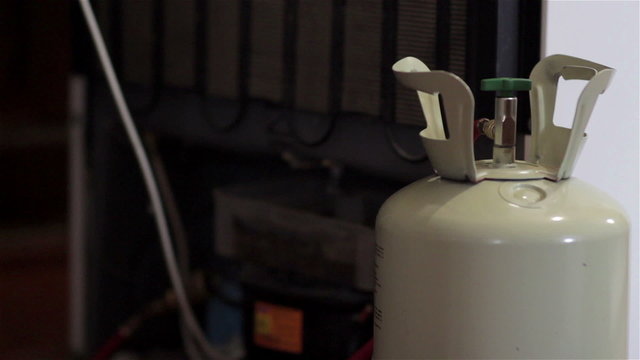 refill refrigerator freon/Freon gas filling fridge in the room at home