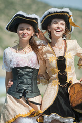 Two girls in pirate costumes