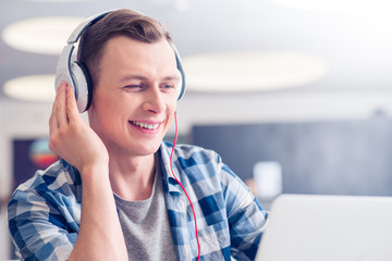 Positive guy listening to music