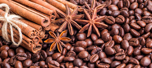 Closeup of two coffee beans at roasted coffee heap. Coffee bean