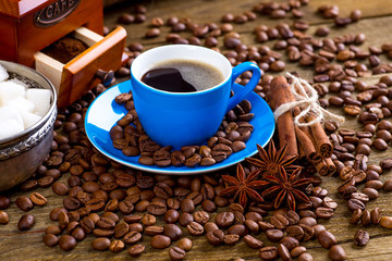 Coffee and coffee bean on wood background