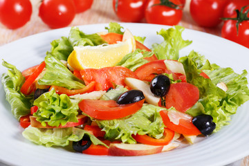 Fresh vegetable salad on the wooden table