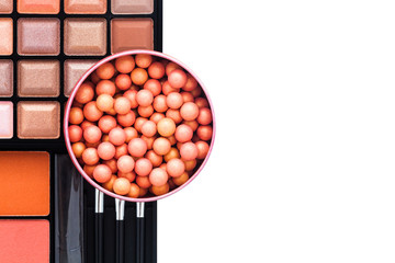 Colorful eye shadows palette with makeup brush.