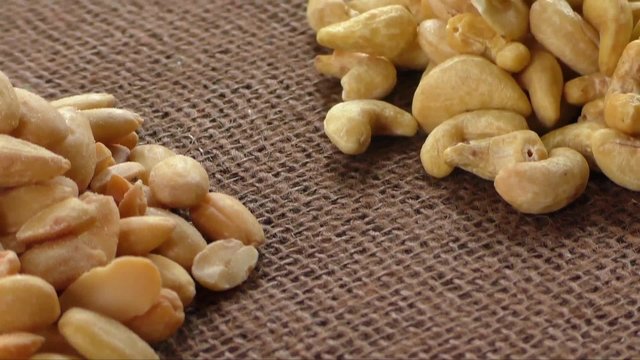 Almonds, cashew, walnuts and hazelnuts lying on burlap 
