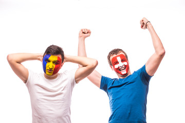 Romania vs  Switzerland. Football fans of national teams demonstrate emotions: Romania lose, Switzerland win. European 2016 football fans concept.