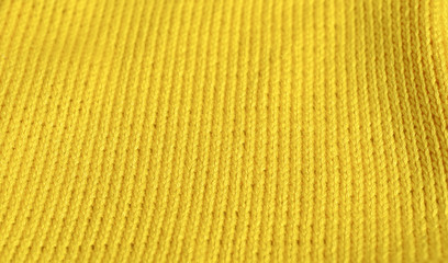 Piece of knitting work - yellow yarn stitches - macro
