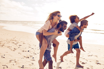Young friends enjoying summertime on the beach