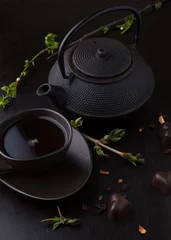 Foto op Aluminium Chocolate candy with tea and teapot © Belokoni Dmitri