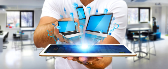 Businessman holding tech device in his hand