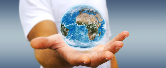 Man holding the planet earth in his hand
