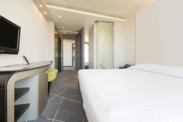 Interior of a double hotel bedroom in the morning