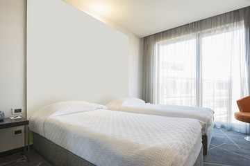 Interior of a double hotel bedroom in the morning