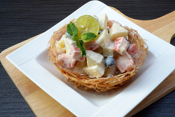 fruit salad in taro basket