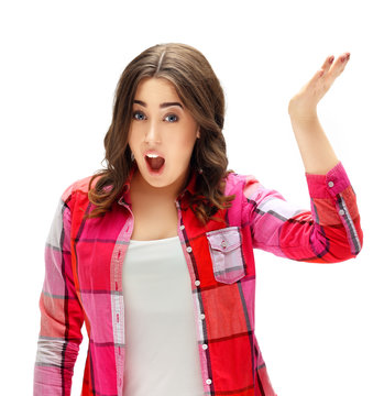 Portrait Of Confused Young Woman Complaining With Raised Hands And Shrugging.