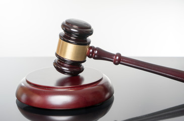 judge gavel / judge gavel over a bright background