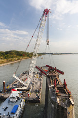 Swimming Crane in action during bridge deconstruction
