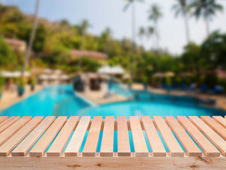 wooden bench with pool background