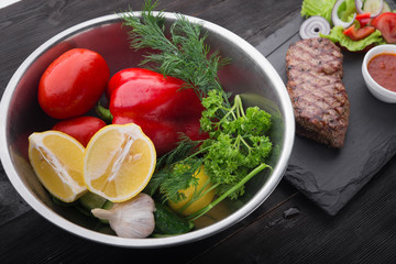 beef steak on with fresh salad on stone