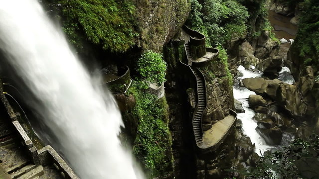 Capture the breathtaking beauty of Pailon del Diablo waterfall in the Ecuadorian Andes as the camera gracefully tilts from the bottom up,tracing the mesmerizing course of the cascading water.