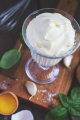 Homemade mayonnaise sauce and ingredients, selective focus, tint