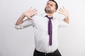 Business man stretches his back and arms