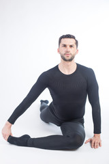 Obraz premium Young male performing yoga