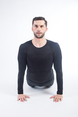 Obraz premium Young male performing yoga