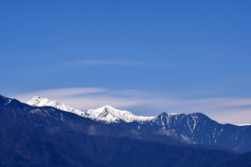 Fototapeta na wymiar Snow Mountain and sunny sky