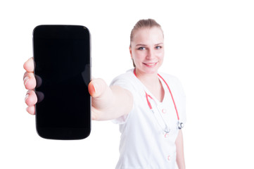 Doctor or medic female presenting blank screen mobile phone