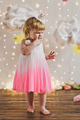 Child in pink dress on the background lights 5437.