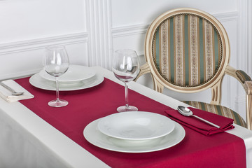 Beautiful decorated table with linen napkins, cutlery on luxurious tablecloth