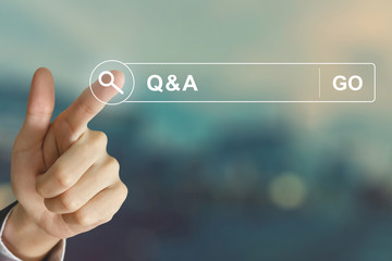 business hand clicking Q&A or Question and Answer button  - obrazy, fototapety, plakaty