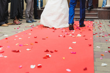 bride and groom on red carpet